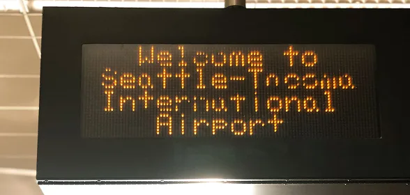 LED display sign reading Welcome to Seattle-Tacoma International Airport