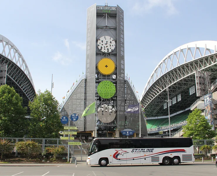 Starline luxury charter bus parked outside CenturyLink Field stadium in Seattle, Washington