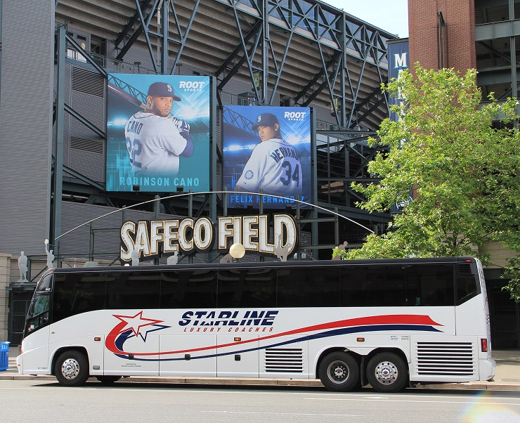 Starline Luxury Coaches motorcoach parked in front of Safeco Field stadium entrance in Seattle