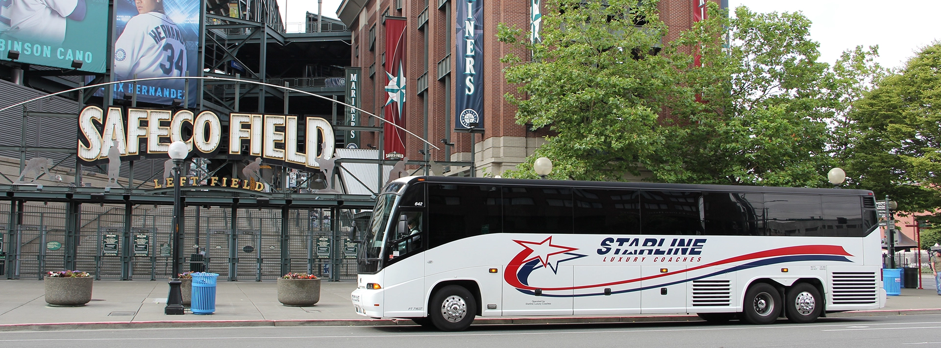 Starline Luxury Coach charter bus parked outside Safeco Field in Seattle for a Mariners game