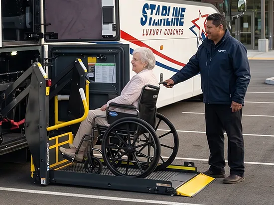 Starline Luxury Coaches driver assists elderly woman in wheelchair using accessible lift on charter bus