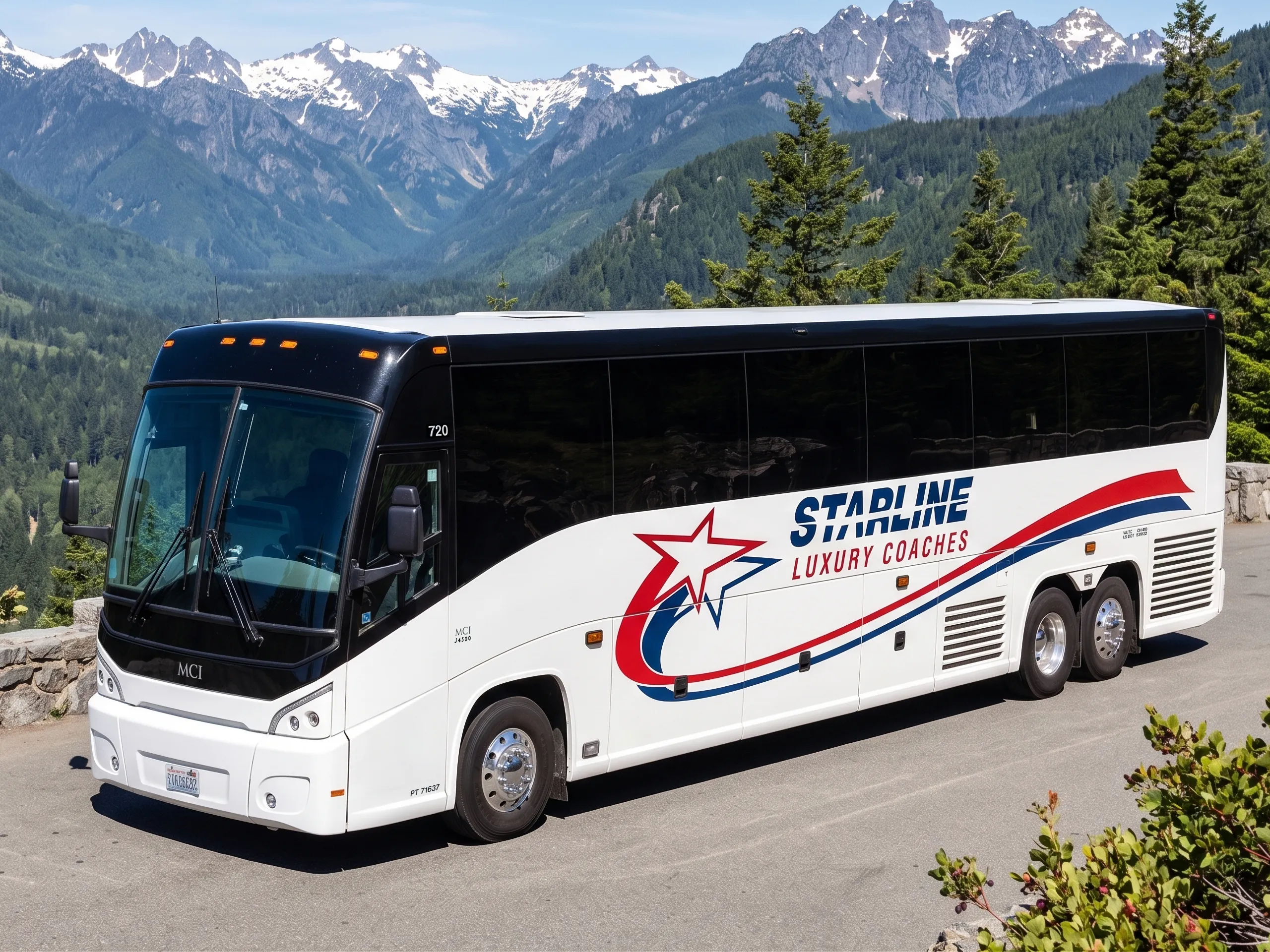 Starline Luxury Coaches MCI charter bus parked at a scenic Pacific Northwest mountain overlook